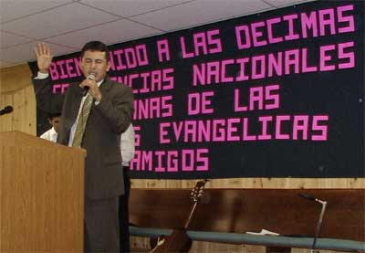Edwin Lima leads prayer for the conference.